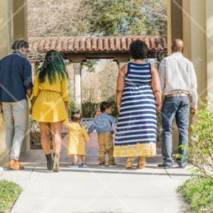 Two Couples Walking With Two Toddlers
